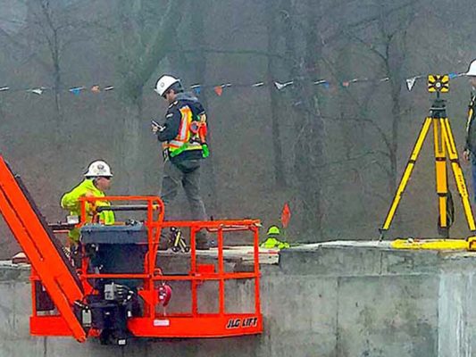 engineers on roof working