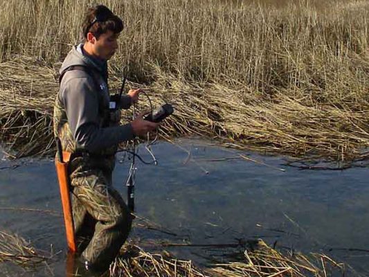 ACT engineer checking water